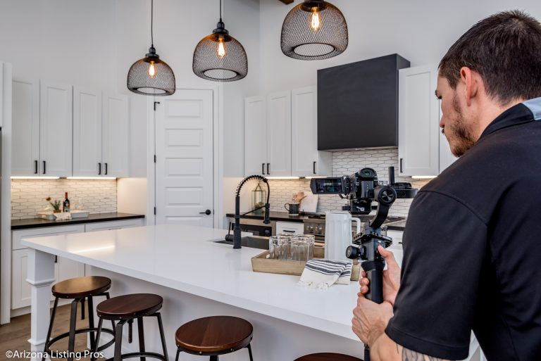 Professional taking video of a kitchen